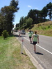 Tom chugs back some water on the run, with support from Gini