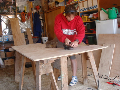 Sanding the top of the desk for about the 15th time.