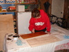 Finally at the waxing stage! Gini waxes a leg.
