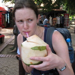 Gini slurps a coconut. Quite delicious!