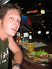 Tom breaths fire after his deep fried fish with chili sauce.