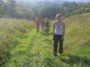 Meandering through grassy meadows.