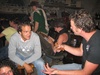Andre teaching Yorick how to use a corkscrew.