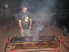 Bastian mans the BBQ.