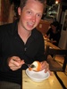 Enjoying an orange filled with orange sorbet!