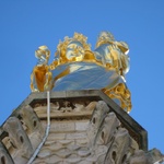 Virgin Mary in gold at the top