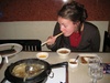 Dipping in egg, then sauce and into your mouth!