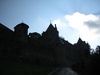 Sun peeking through the cloud over the Medieval Cité