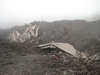 A three story hotel destroyed in the 2002 eruption.