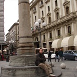 Tom sits on the only Roman pillar left standing from the Roman Forum