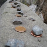 A coin or stone to show you have been there to pray