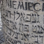 Warsaw: Hebrew on the memorial piece to mark a house in the upraising in Warsaw