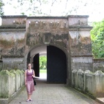 Posing by an old gateway