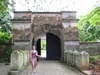Posing by an old gateway