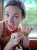 Happy in her work, making a lolly necklace for leece