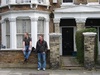 Some shady locals hanging on their stoop