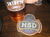 Tasting some of the local brew while sheltering from the elements