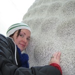 Gini hugs an acorn shaped piece of marble