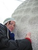 Gini hugs an acorn shaped piece of marble