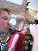 Tasting the wine from the biggest glass ever.