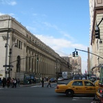 The Post Office with the inscription "Neither snow nor rain nor heat nor gloom of night stays these couriers from the swift completion of their appointed rounds" running the entire length of the massive building.