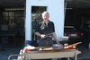 Dad mans the BBQ, the day after the wedding.