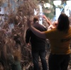 Kids throwing around ripped up newspaper