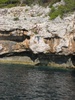 Plummeting to the sea below.