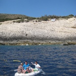 Josh and Marcus row in circles on their way to the blue cave.