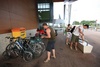 Strapping our grocery supplies to our bikes. We hadn't thought this through.