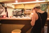 Tom is already in there ordering our coffees