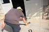 Tom picks up his toy