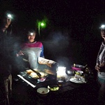 The head lamps came on as we cooked outside