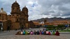 Peruvian's all in a row. Love the pig tails and bowler hats