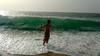 Playing chicken with the big waves on a beach near Nazare, Portugal. The waves always win, but great fun.