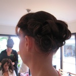 Lisa's hair is complete as Nat gets the royal treatment in the background