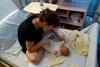Preparing Olive in Nana's outfit.