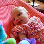 The cutest flower outfit around, beginning to smile