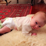 Tummy time by the heater, 8 weeks old