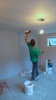 The first coat of plaster goes up