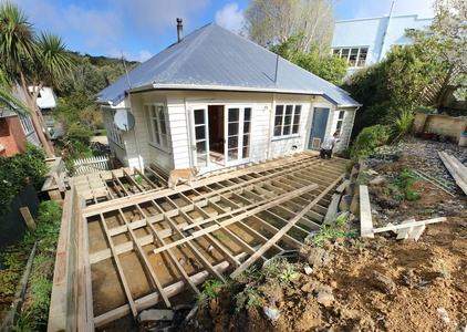 The bearers and the joists go down.