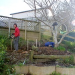 The retaining wall holes get dug