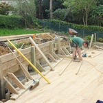 The back retaining wall is up as the first iteration of steps is constructed. 