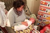 Bug Baby flies in for a feed.