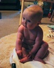 Sitting pretty. Only lasts a few seconds at a time, but she sure looks cute before she topples.