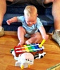 Olive gets her second early birthday present. A cool xylophone from Nan and Grandad.