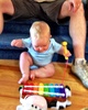 Olive gets her second early birthday present. A cool xylophone from Nan and Grandad.