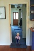 Getting the hang of the jolly jumper. Stinkle wants in on the action too.