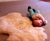 This morning Olive wiggled a 180 off the sheepskin to get a better look at the fire.