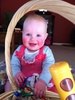 I'm a big girl now! Sitting up and choosing my toys!